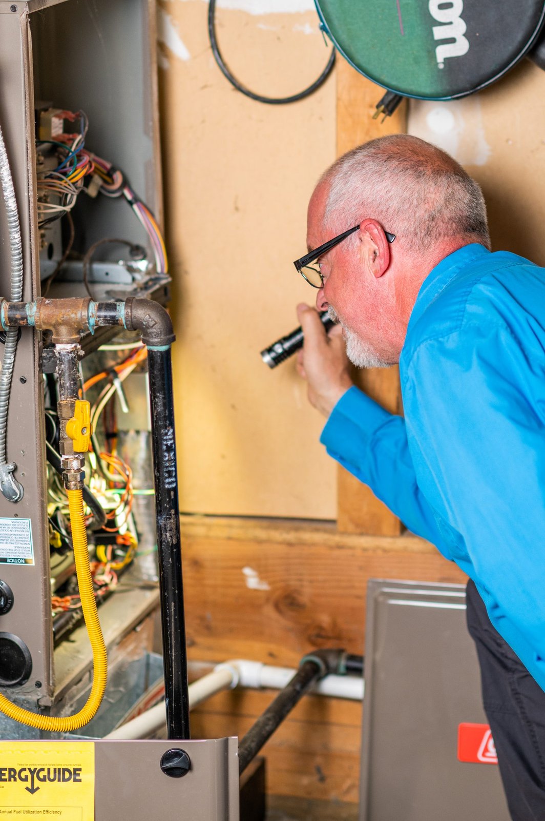 Bryan Mize inspecting HVAC system
