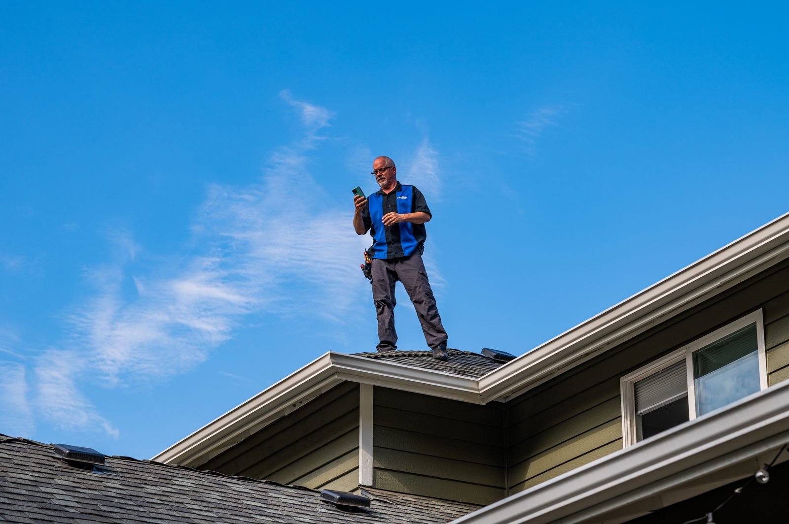 Bryan Mize on a rooftop inspection