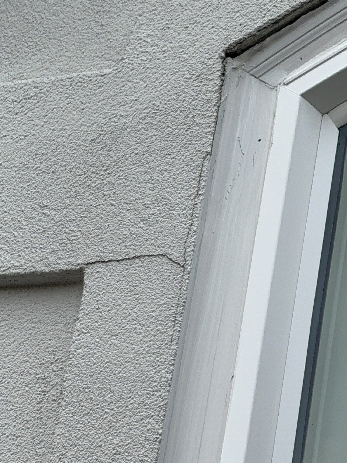EIFS synthetic stucco siding showing cracking near a window trim — a serious envelope finding from a recent Mukilteo inspection.