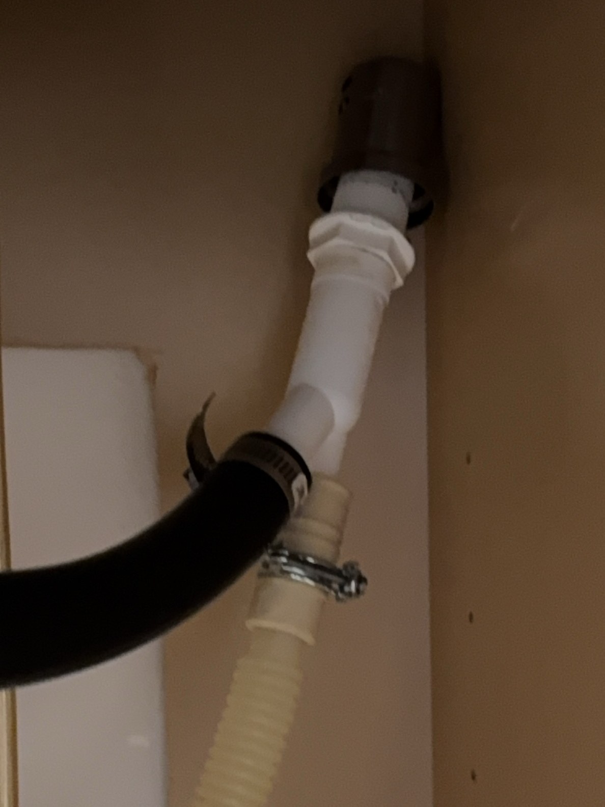 Improperly routed dishwasher drain plumbing under the kitchen sink — found during a recent Poulsbo inspection.