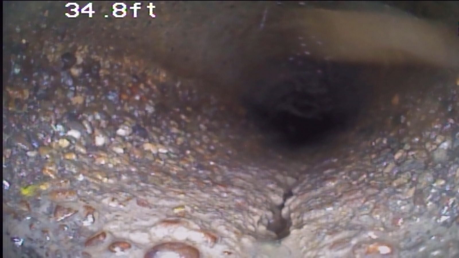 Sewer scope showing cracked concrete pipe
