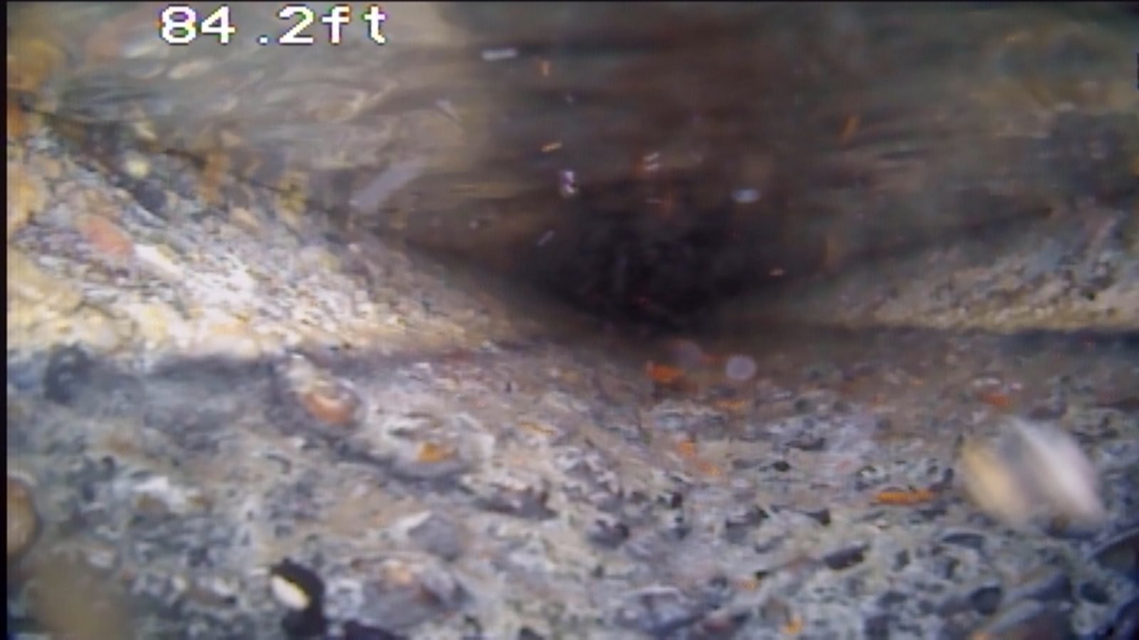 Sewer debris and deterioration at 84 feet