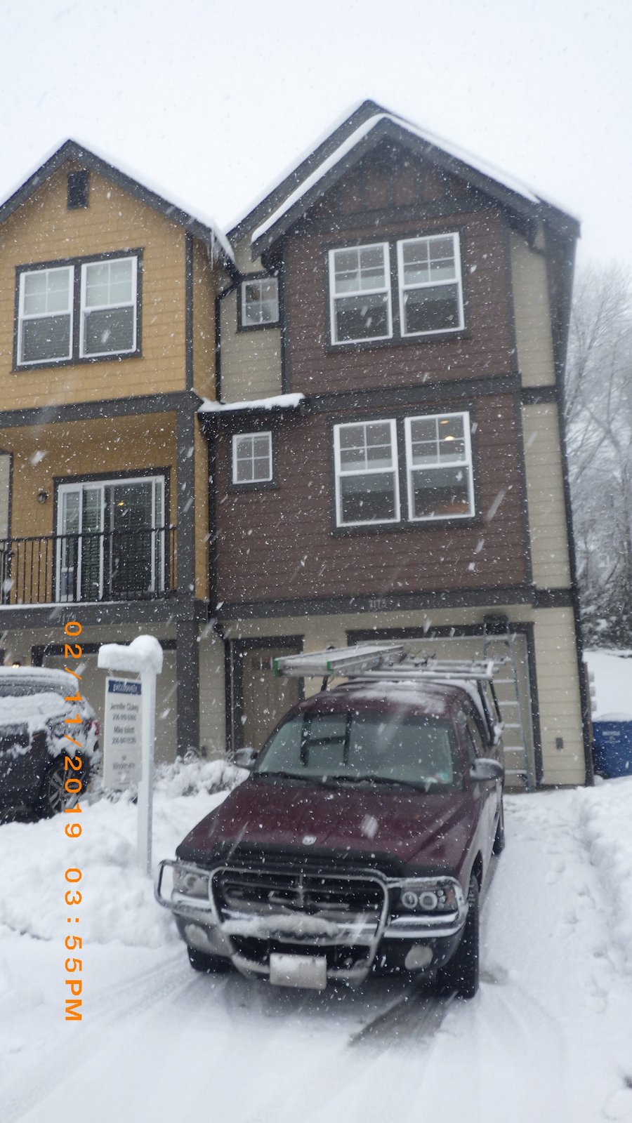 Optimized Inspection Services truck at a property in the snow